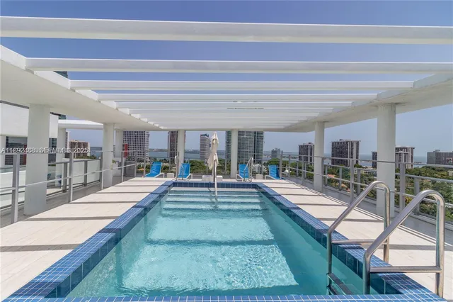 a view of a living room and kitchen