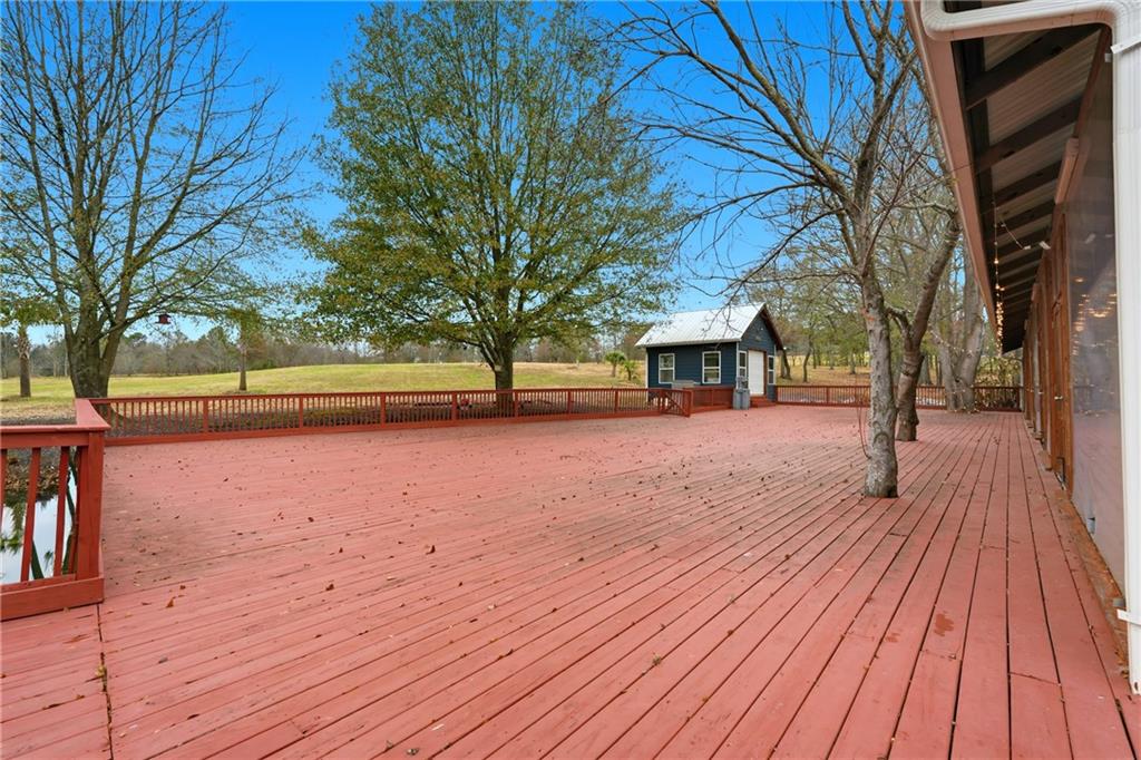 1188 Carl-Bethlehem Road Winder, GA 30680 - Photo 9 of 23 a swimming pool with trees in front of it