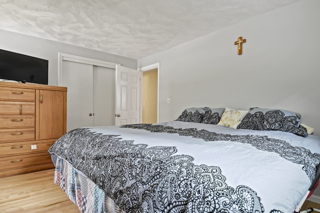 14 Porter Street Billerica, MA 01821 - Photo 19 of 33 a bedroom with a bed and flat screen tv