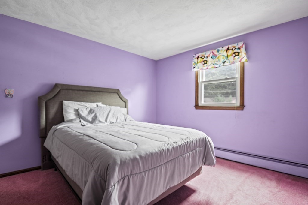 14 Porter Street Billerica, MA 01821 - Photo 21 of 33 a bedroom with a bed and a painting on the wall