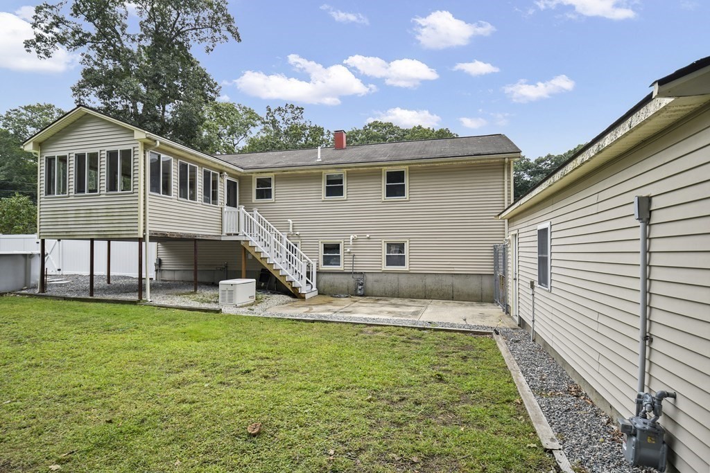 14 Porter Street Billerica, MA 01821 - Photo 30 of 33 a view of a house with a yard and sitting area