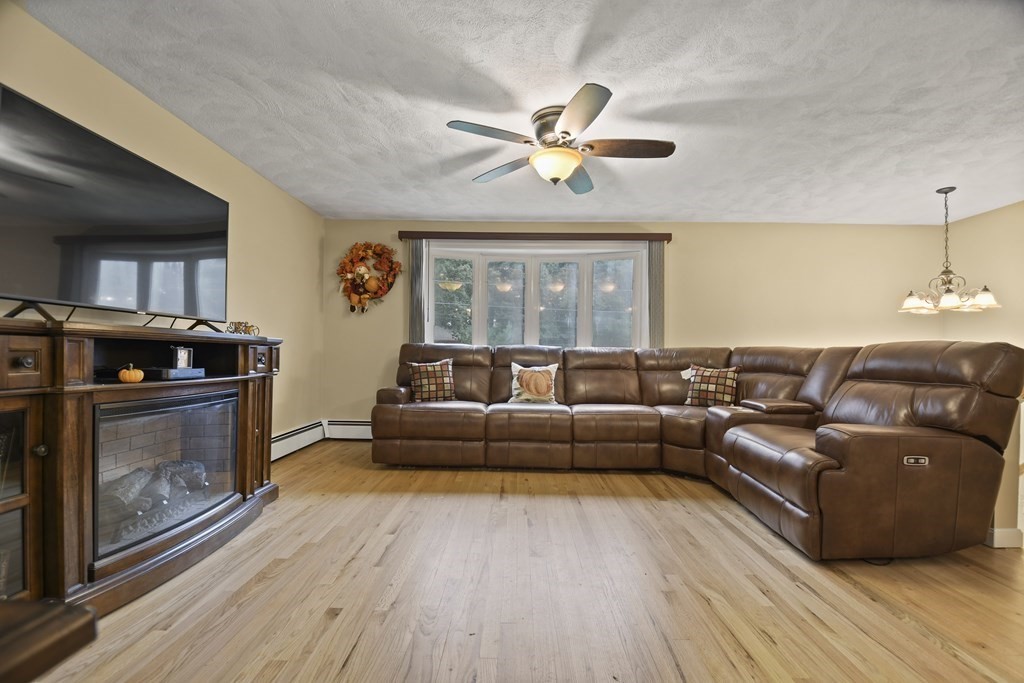14 Porter Street Billerica, MA 01821 - Photo 3 of 33 a living room with furniture and a fireplace