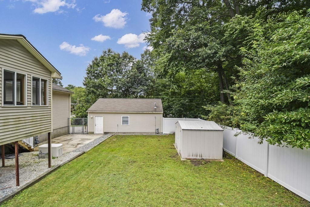 14 Porter Street Billerica, MA 01821 - Photo 32 of 33 a view of a house with a yard