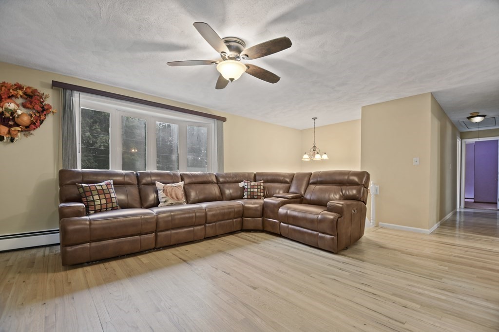 14 Porter Street Billerica, MA 01821 - Photo 4 of 33 a living room with furniture and a large window