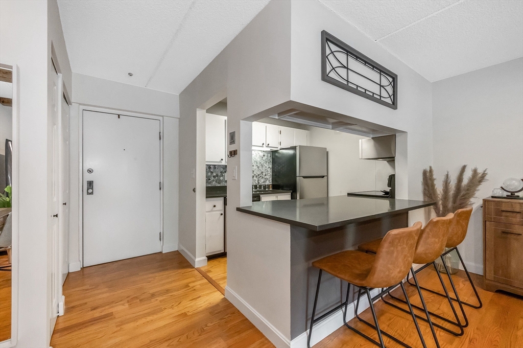 159 Main Street, Unit 15B Stoneham, MA 02176 - Photo 1 of 25 a view of a kitchen and dining room