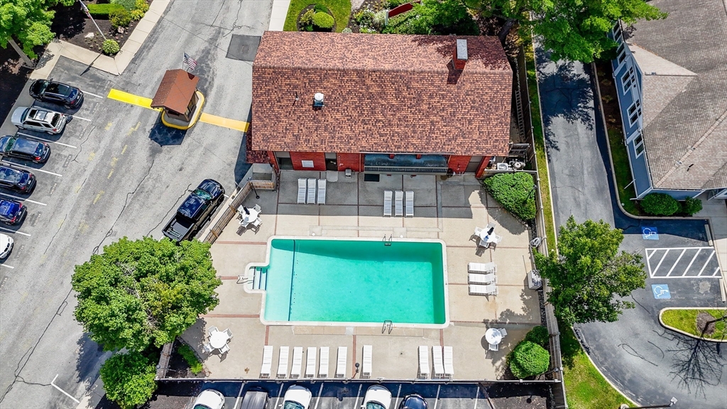 159 Main Street, Unit 15B Stoneham, MA 02176 - Photo 21 of 25 an aerial view of a house with garden space and street view