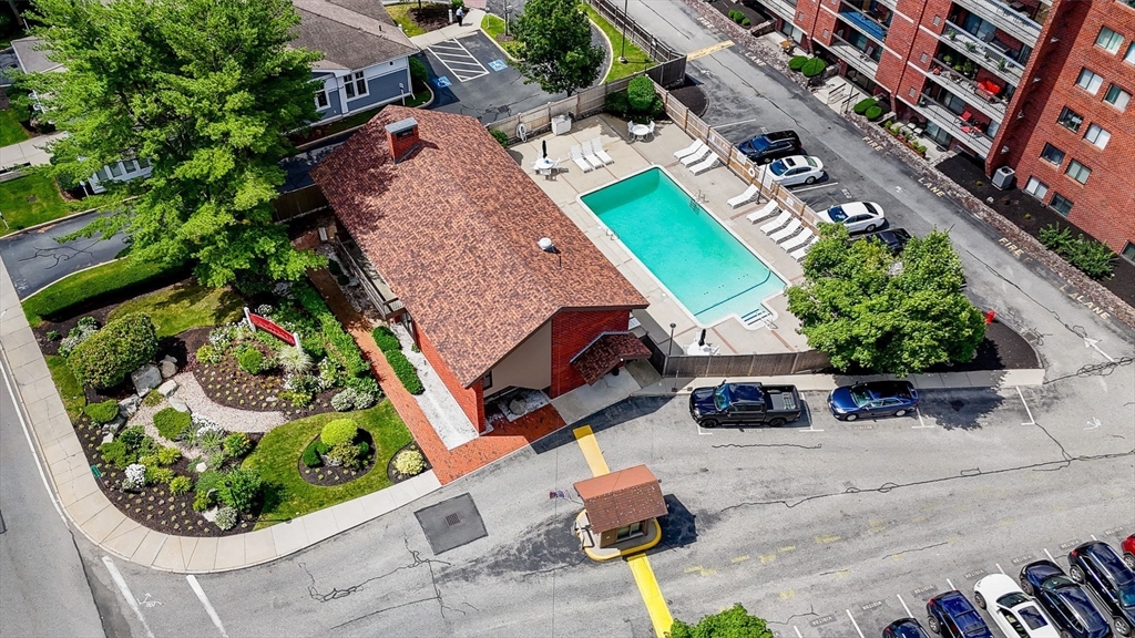 159 Main Street, Unit 15B Stoneham, MA 02176 - Photo 22 of 25 an aerial view of a house with a yard