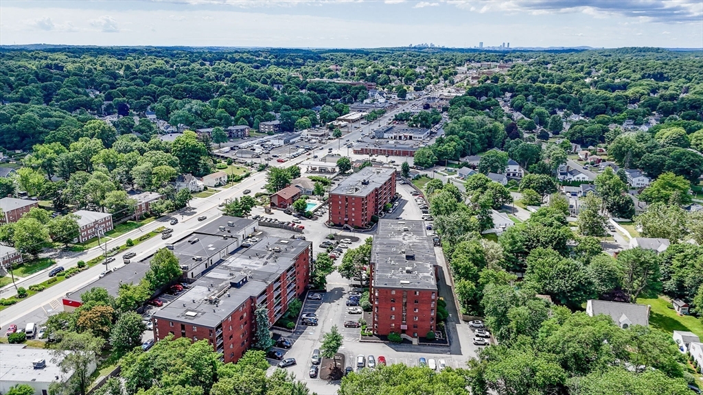159 Main Street, Unit 15B Stoneham, MA 02176 - Photo 24 of 25 an aerial view of a house with a yard