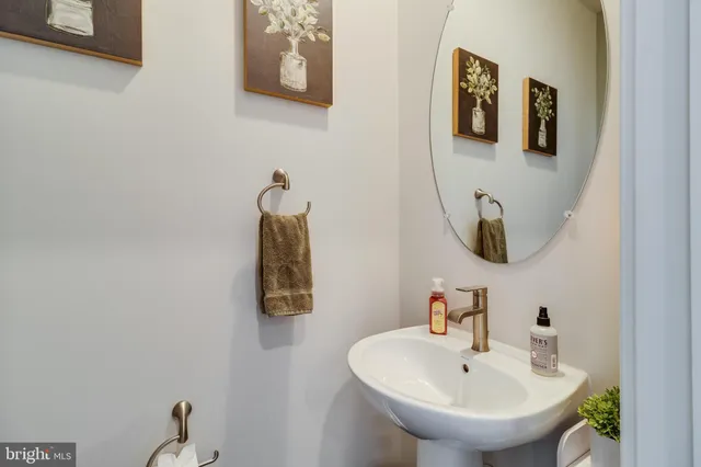 a bathroom with a sink and mirror