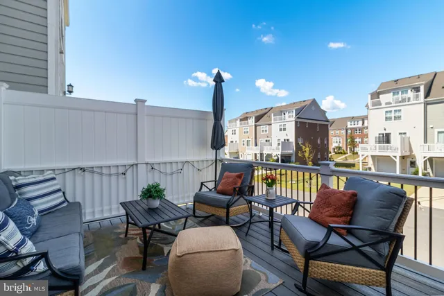 a view of a chairs and table in patio
