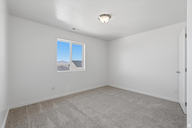 1218 Moonlight Drive Elk Ridge, UT 84651 - Photo 22 of 44 Unfurnished room featuring light carpet and baseboards