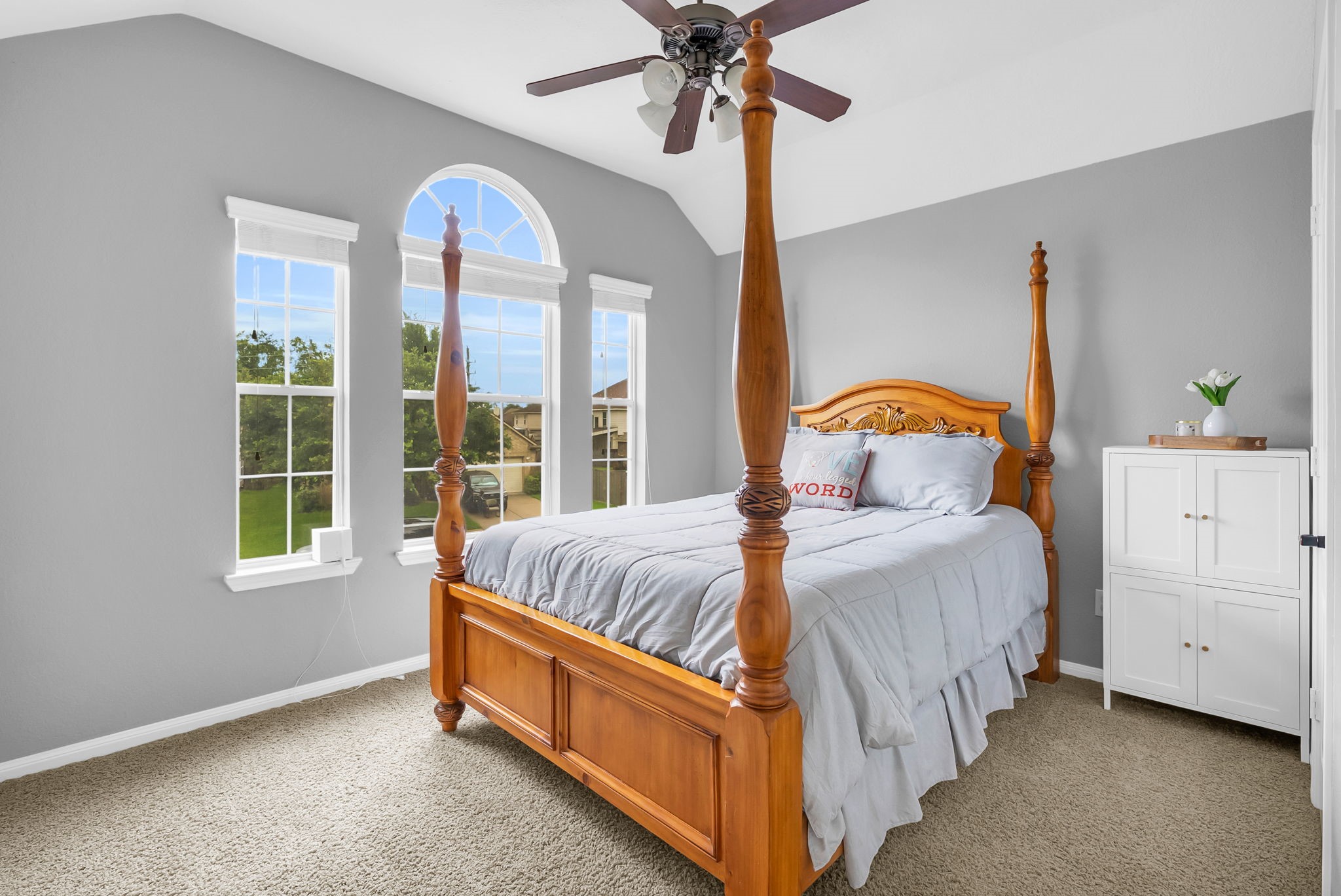 16619 Dover Mills Drive Spring, TX 77379 - Photo 31 of 49 a bedroom with a bed and a chandelier