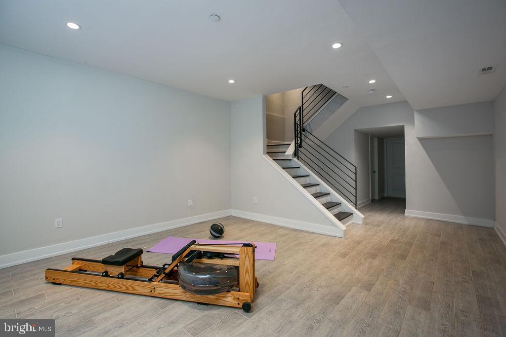 307-9 Reed Street, Unit C Philadelphia, PA 19147 - Photo 25 of 27 Basement living area w/storage closet & mechanical