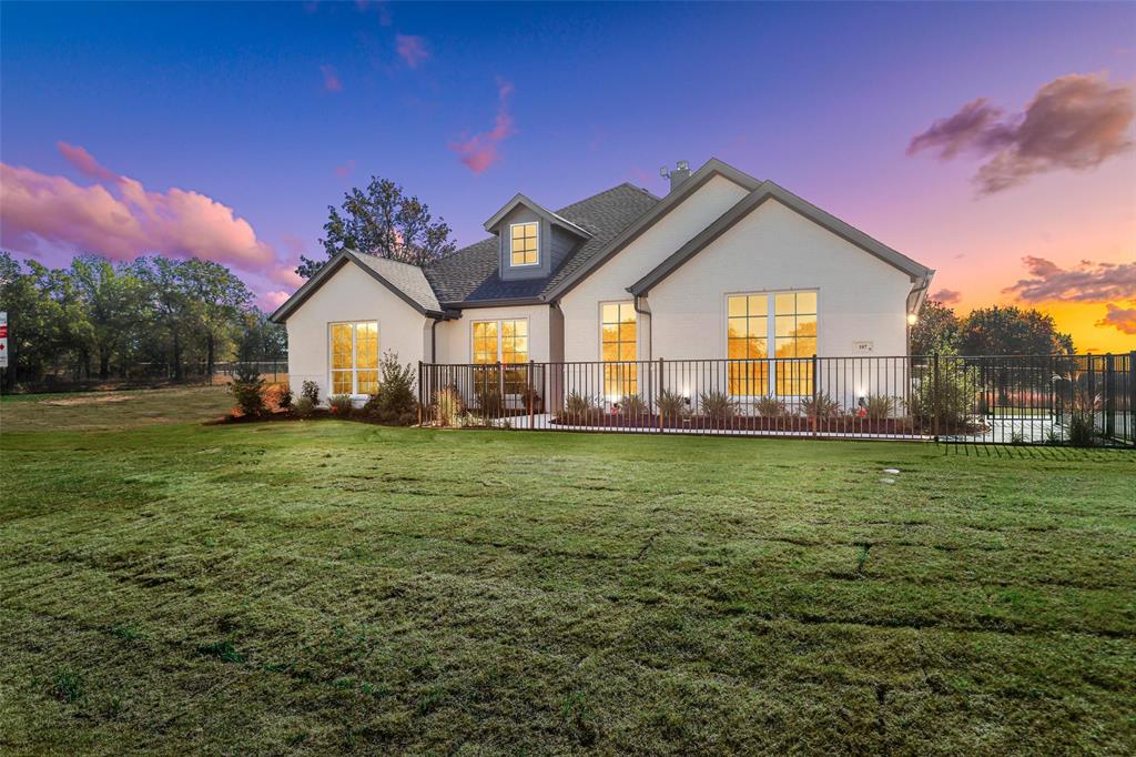 147 Rj Smith Drive Boyd, TX 76023 - Photo 1 of 15 a front view of a house with a yard
