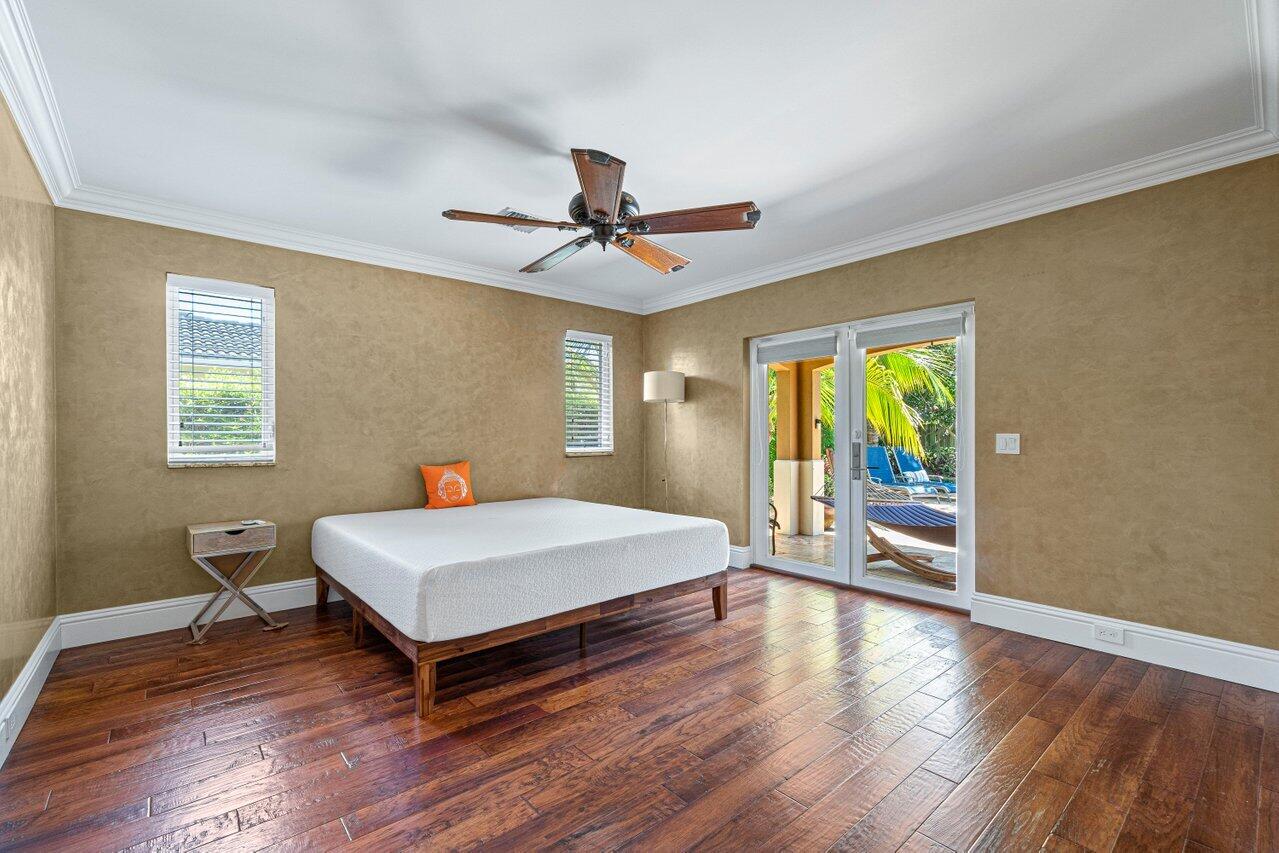 870 Northwest 7th Street Boca Raton, FL 33486 - Photo 21 of 37 a room with a bed and a table