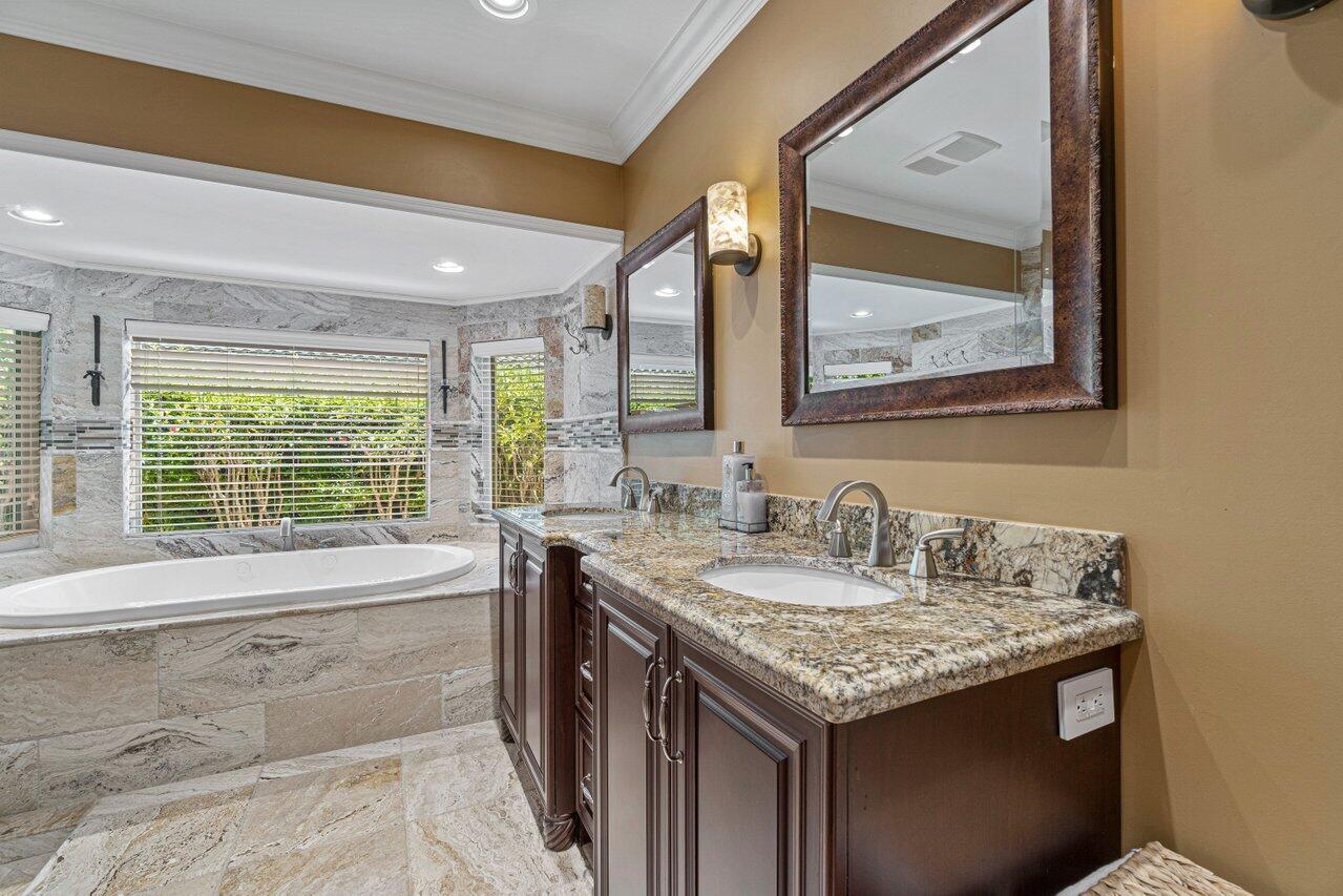 870 Northwest 7th Street Boca Raton, FL 33486 - Photo 25 of 37 a bathroom with a granite countertop sink and a large mirror