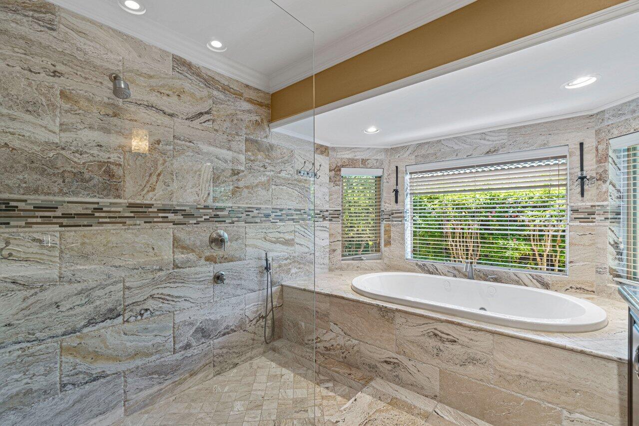 870 Northwest 7th Street Boca Raton, FL 33486 - Photo 26 of 37 a spacious bathroom with a bathtub and next to a window