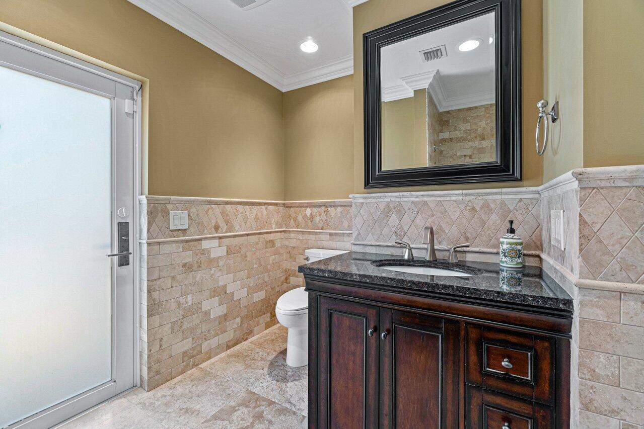 870 Northwest 7th Street Boca Raton, FL 33486 - Photo 31 of 37 a bathroom with a sink and a mirror