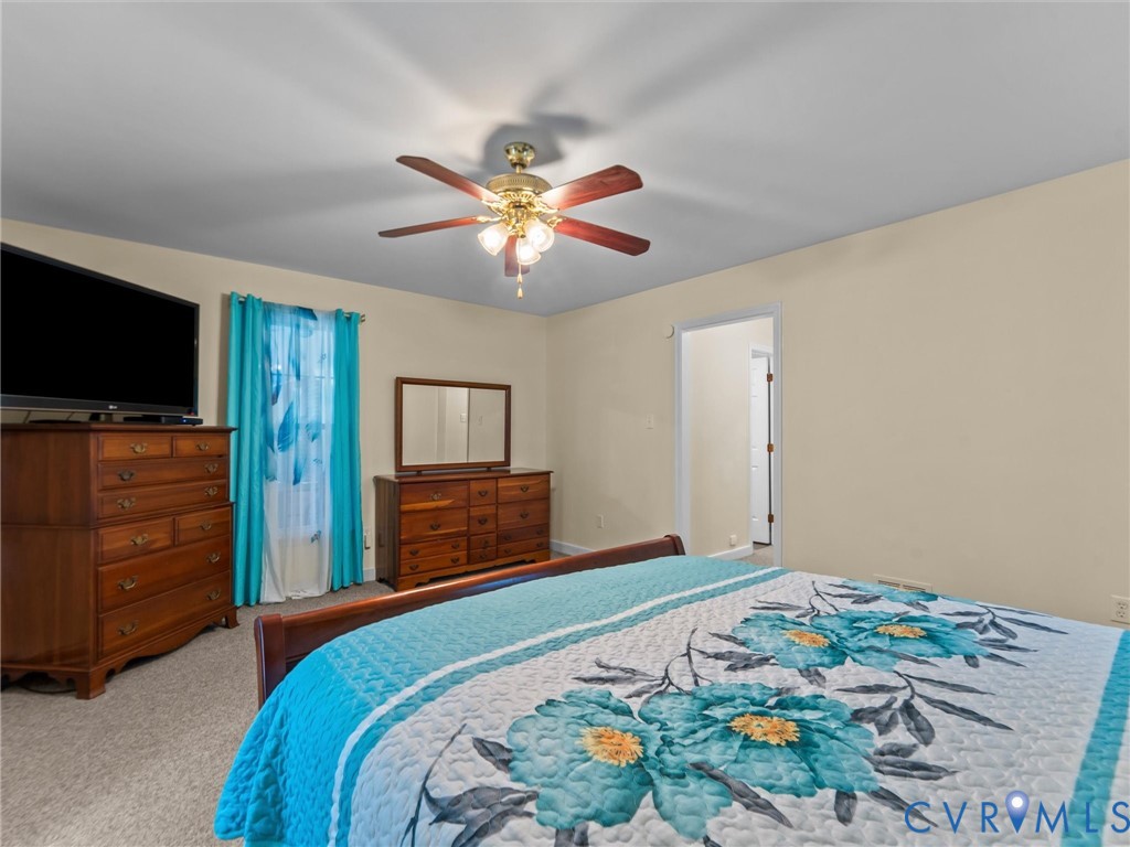 3420 State Rte 656 Powhatan, VA 23139 - Photo 23 of 37 a bedroom with a bed and a flat screen tv