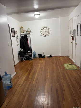 a view of a room with wooden floor