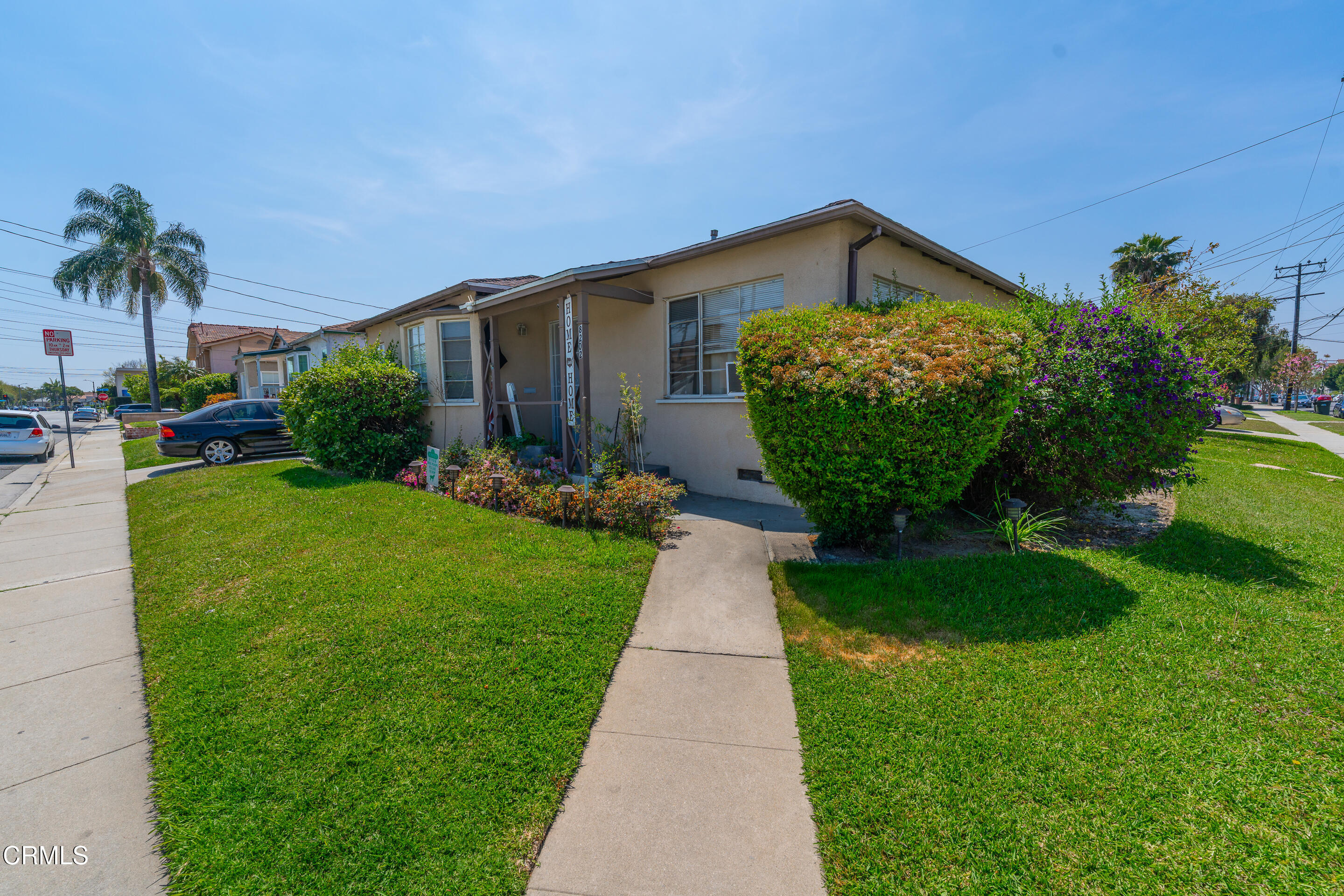 8202 5th Street Downey, CA 90241 - Photo 3 of 10 a front view of a house with garden