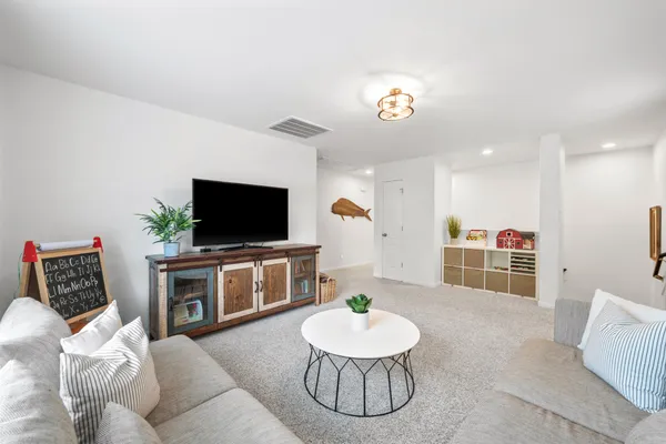 a bathroom with a double vanity sink mirror and shower
