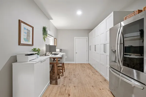 a view of a dining room with furniture and wooden floor