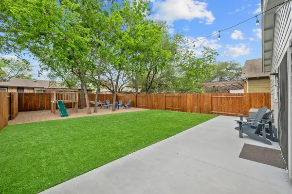 a view of house with patio outdoor seating and barbeque oven