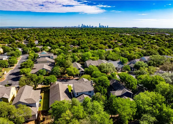 an aerial view of residential houses with outdoor space