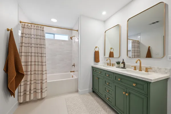 a bedroom with a bed and a television