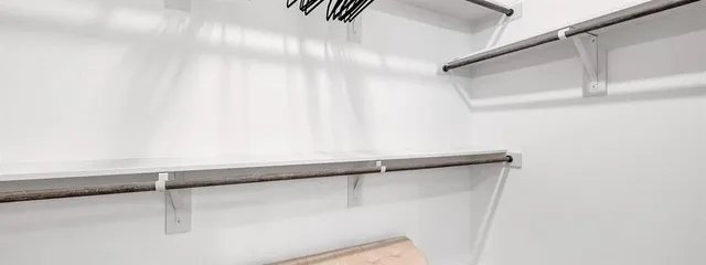 a view of storage and utility room with washer and dryer