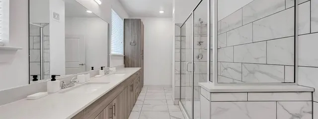 a kitchen with counter top space a sink cabinets and appliances