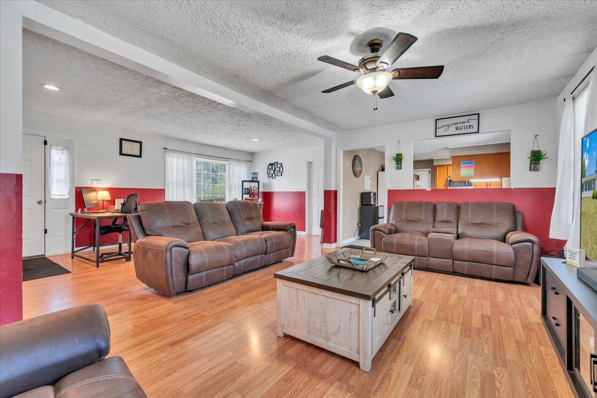 3870 Goose Dam Road Rocky Mount, VA 24151 - Photo 10 of 44 a living room with furniture and wooden floor