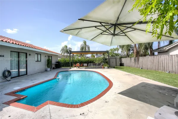 a view of a swimming pool with a patio