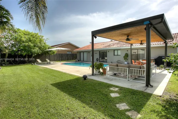 a view of a house with a yard patio and a patio