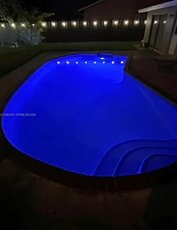 a view of a red yard with swimming pool