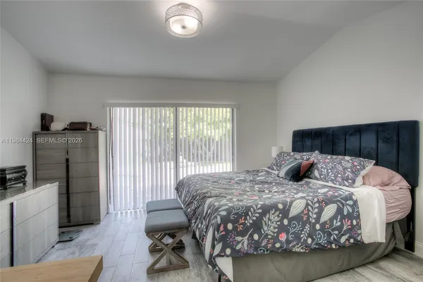 a bedroom with a bed and a couch