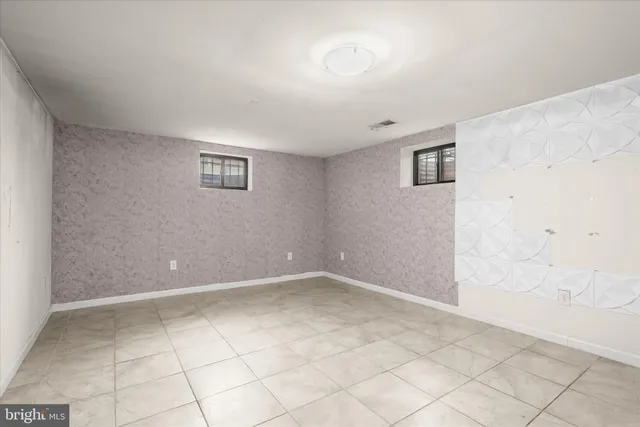 an empty room with white walls