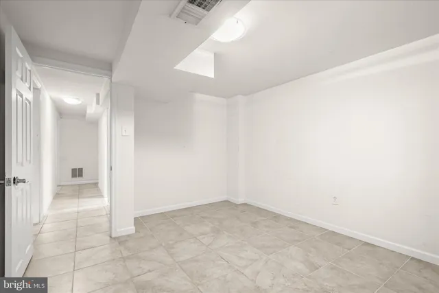 an empty room with a bathroom