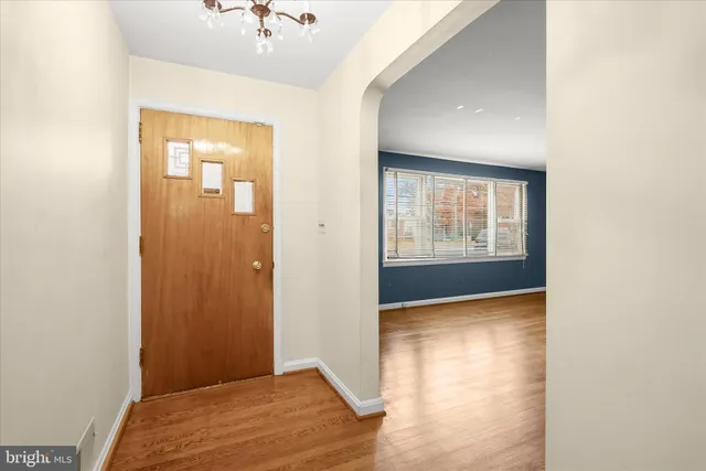 a view of hallway with a front door