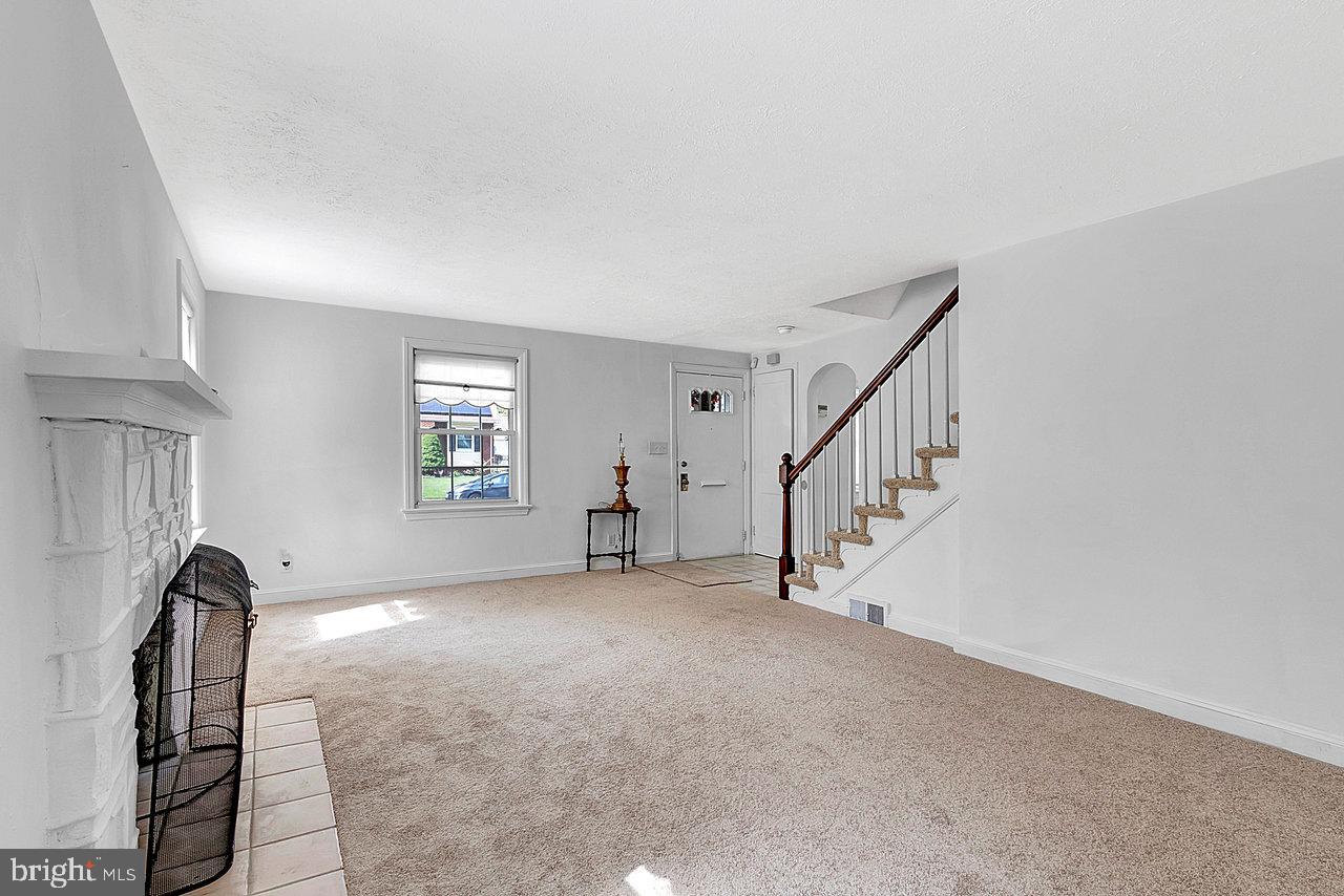415 Sutherland Road Ewing, NJ 08618 - Photo 12 of 28 a view of a livingroom with a staircase