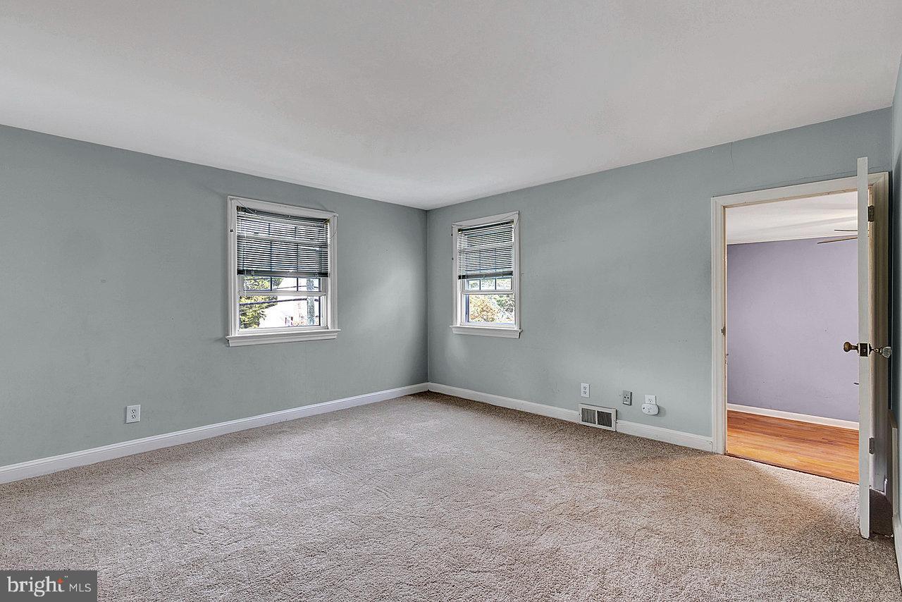 415 Sutherland Road Ewing, NJ 08618 - Photo 14 of 28 an empty room with windows