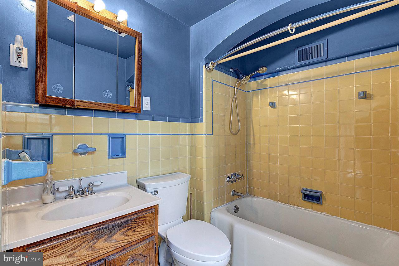 415 Sutherland Road Ewing, NJ 08618 - Photo 18 of 28 a bathroom with a sink a toilet and shower