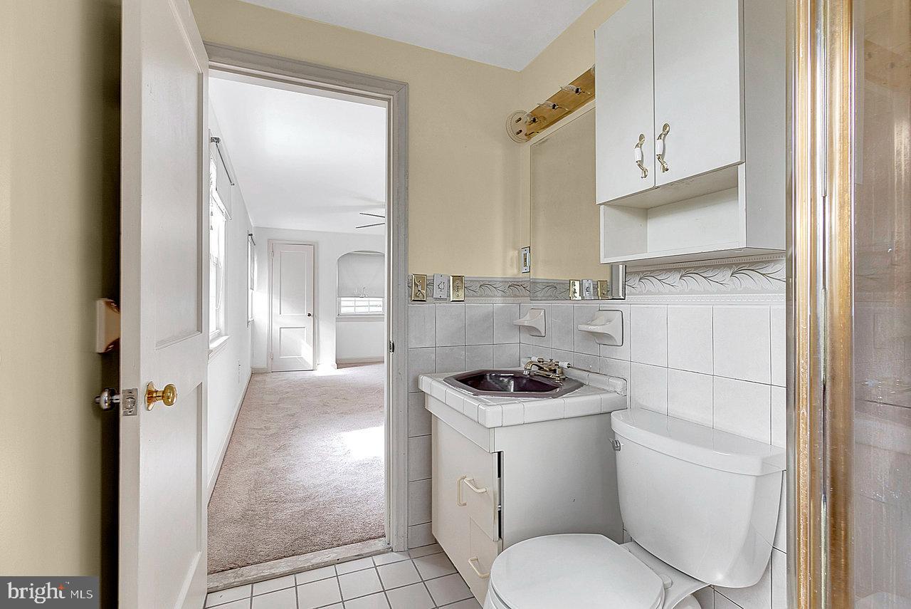 415 Sutherland Road Ewing, NJ 08618 - Photo 22 of 28 a bathroom with a sink toilet and shower