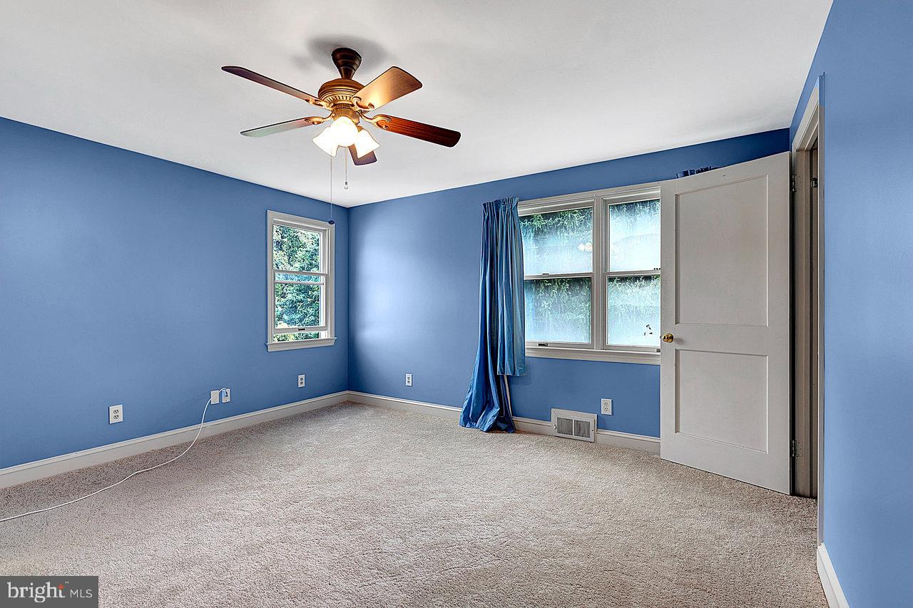 415 Sutherland Road Ewing, NJ 08618 - Photo 24 of 28 an empty room with windows and fan