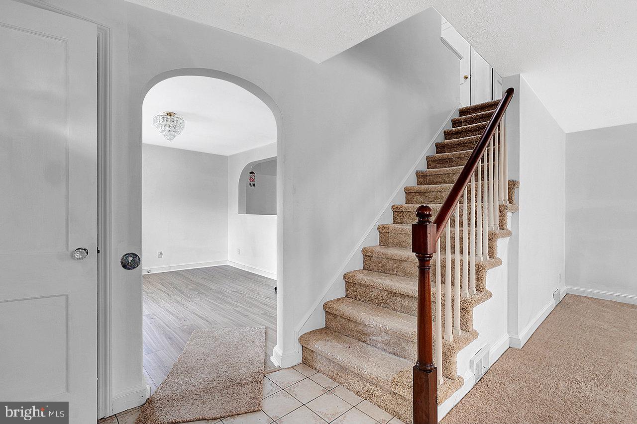 415 Sutherland Road Ewing, NJ 08618 - Photo 3 of 28 a view of entryway and hall with wooden floor