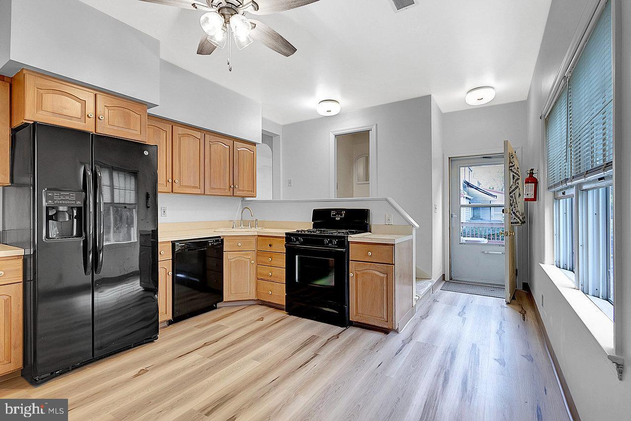 415 Sutherland Road Ewing, NJ 08618 - Photo 9 of 28 a kitchen with granite countertop a refrigerator stove top oven and sink