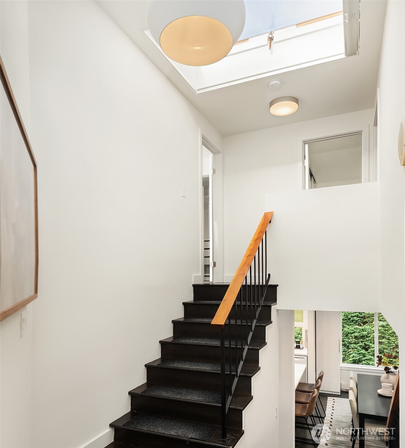 202 West Olympic Place, Unit 405 Seattle, WA 98119 - Photo 12 of 26 a view of entryway and hall with wooden floor