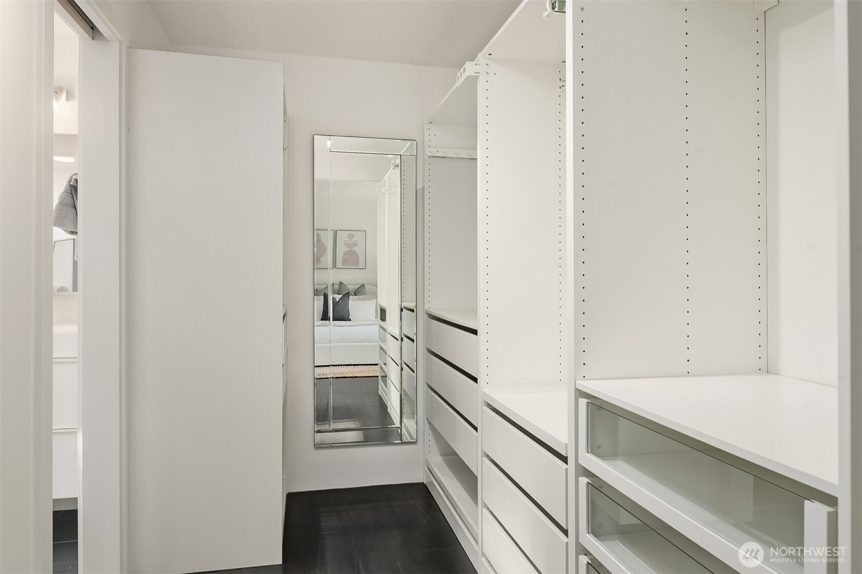 202 West Olympic Place, Unit 405 Seattle, WA 98119 - Photo 13 of 26 a hallway with white cabinets and wooden floor