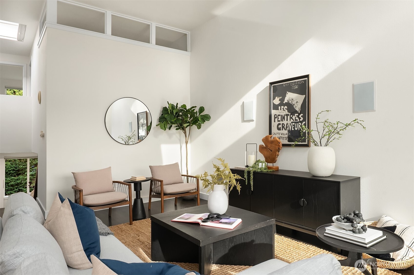 202 West Olympic Place, Unit 405 Seattle, WA 98119 - Photo 2 of 26 a living room with a couch and a table